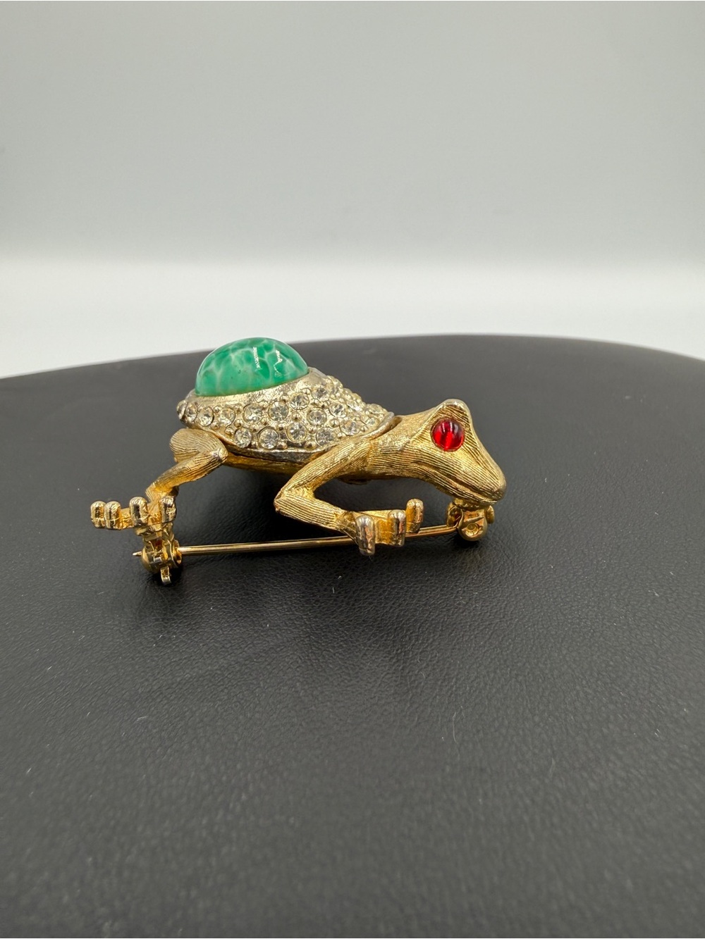 Gold-Tone Frog Brooch with Green Cabochon and Red Eye Accent